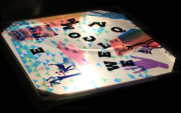 The bed of a projector with assorted letters and coloured shapes