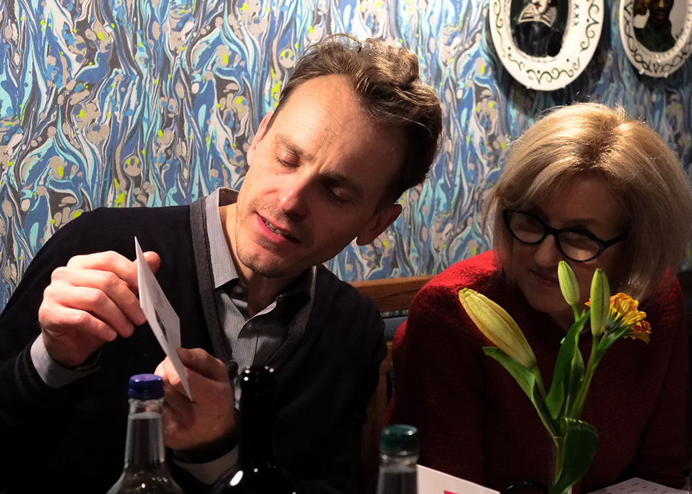 Guests talk and participate in the evening