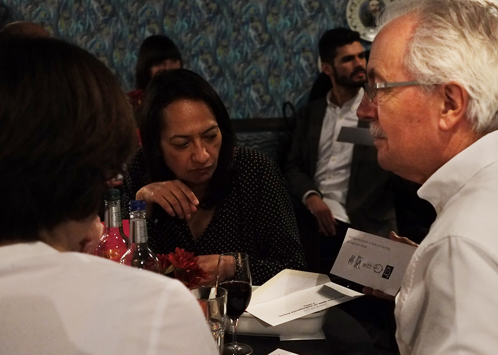 Guests talk and participate in the evening