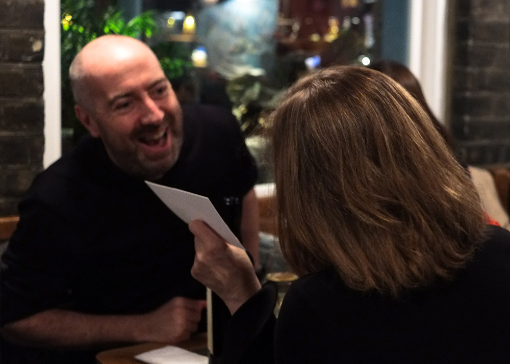 Guests talk and participate in the evening